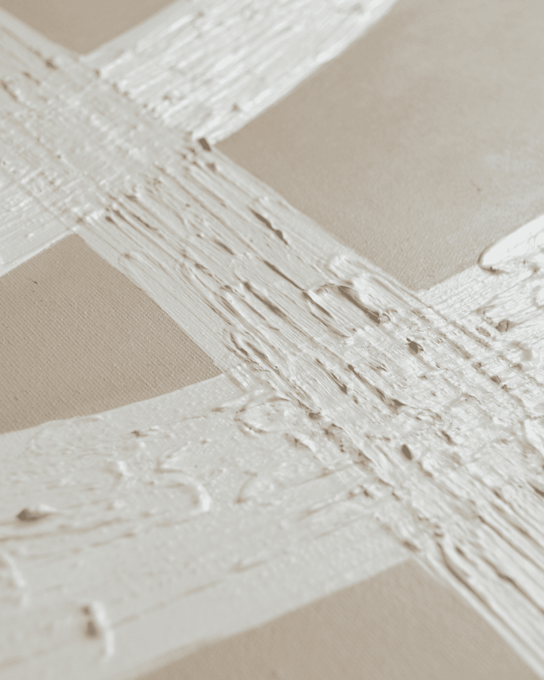 Macro detail of textured white impasto paint on canvas